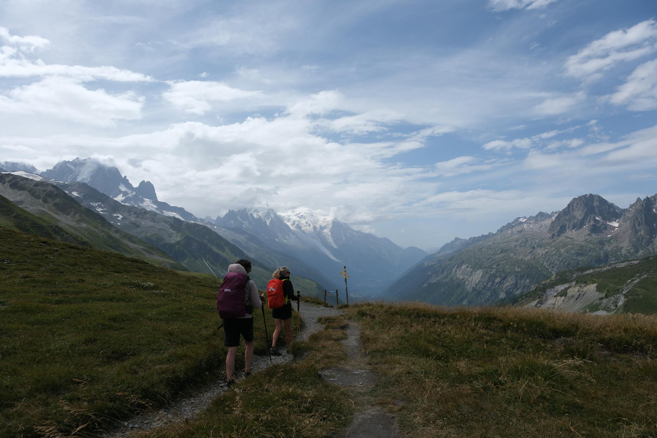 Host leading hikers in the mountains